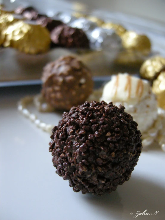 a plate topped with cake and chocolate balls