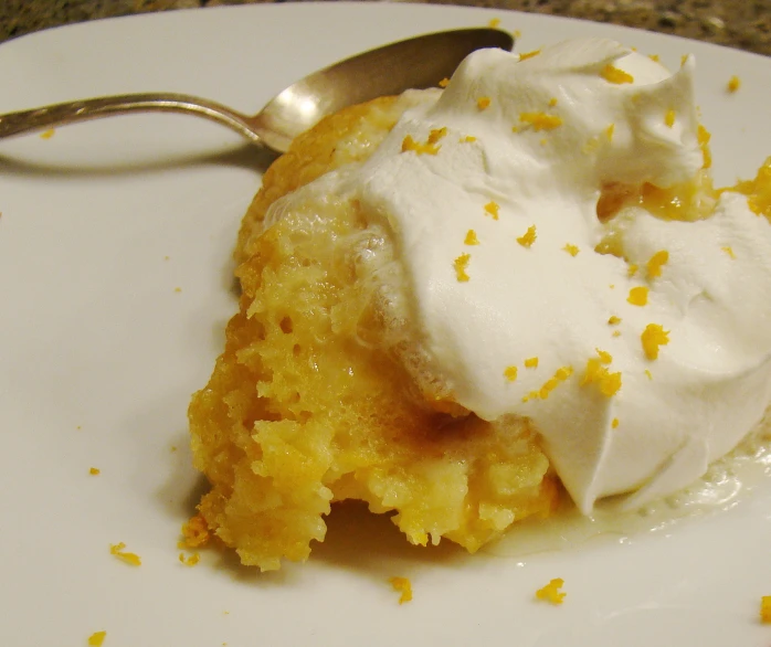 a desert on a plate with a spoon