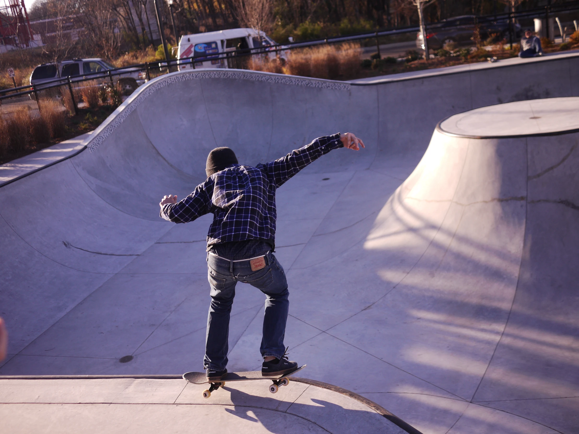 the skateboarder is skating at the skate park