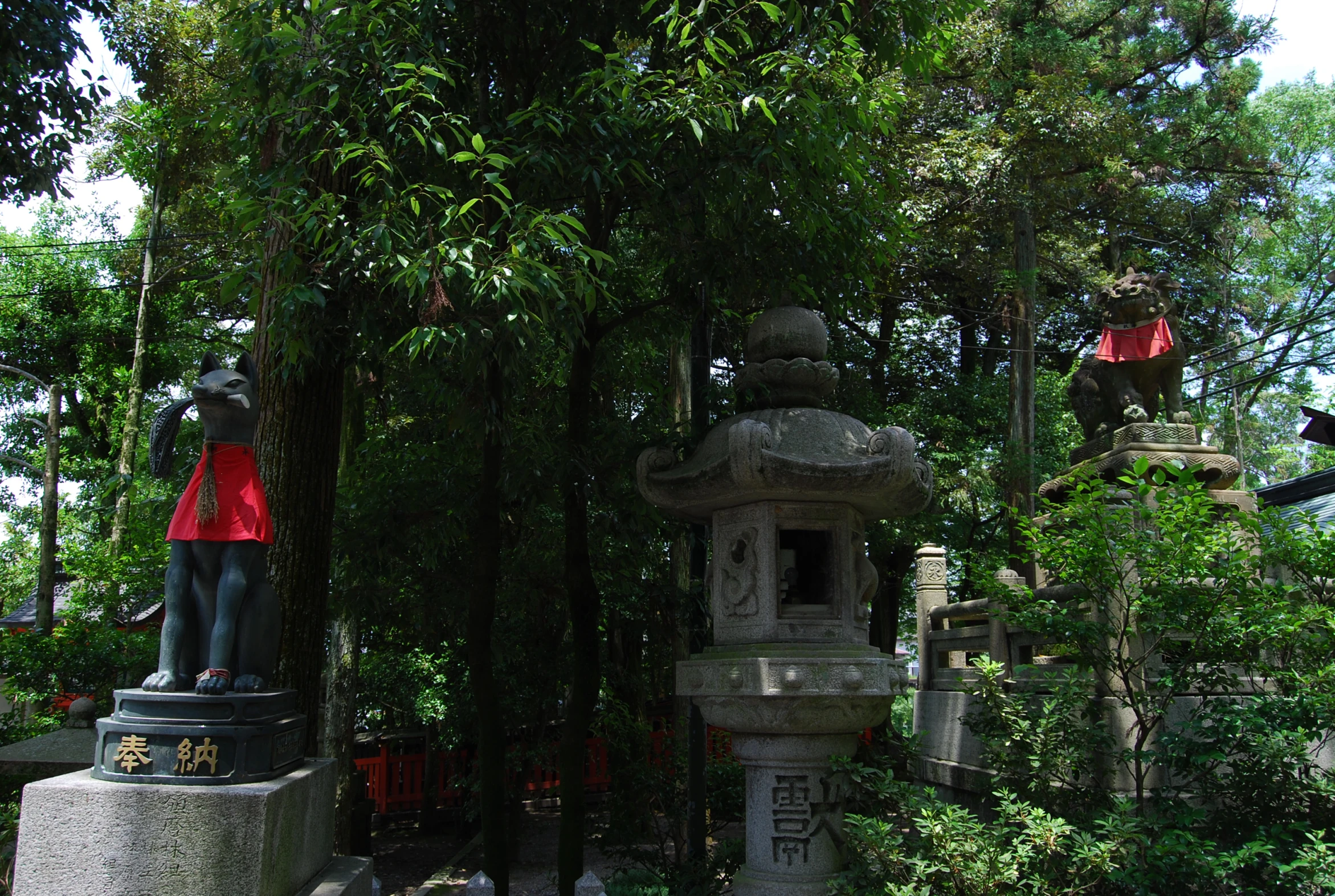 a statue in a garden in a temple