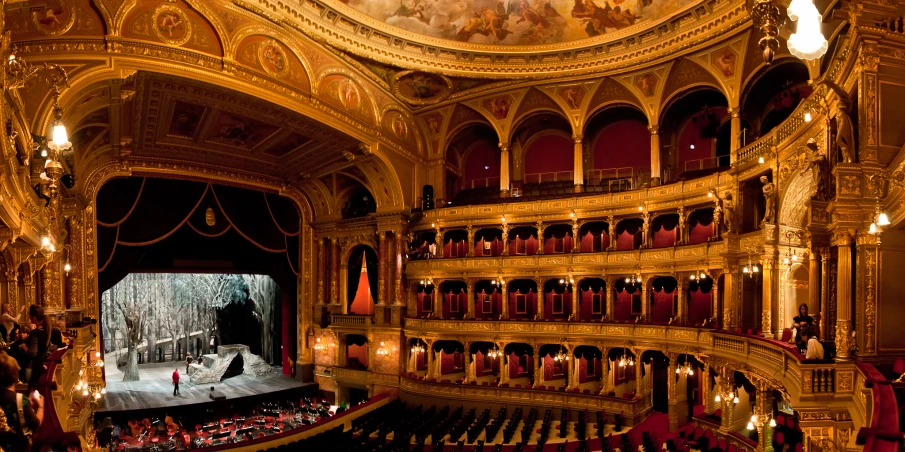 a theater with people performing on the stage