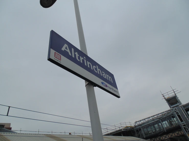 an antenna sits near the top of the street light pole