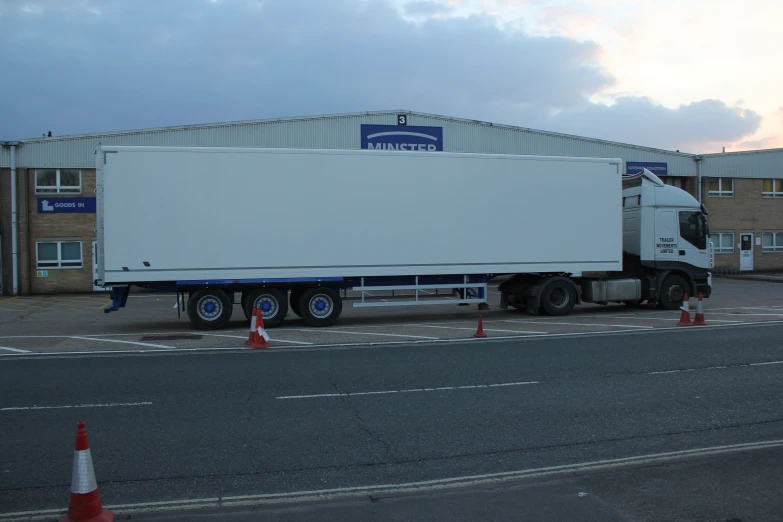 a semi truck is parked in the parking lot