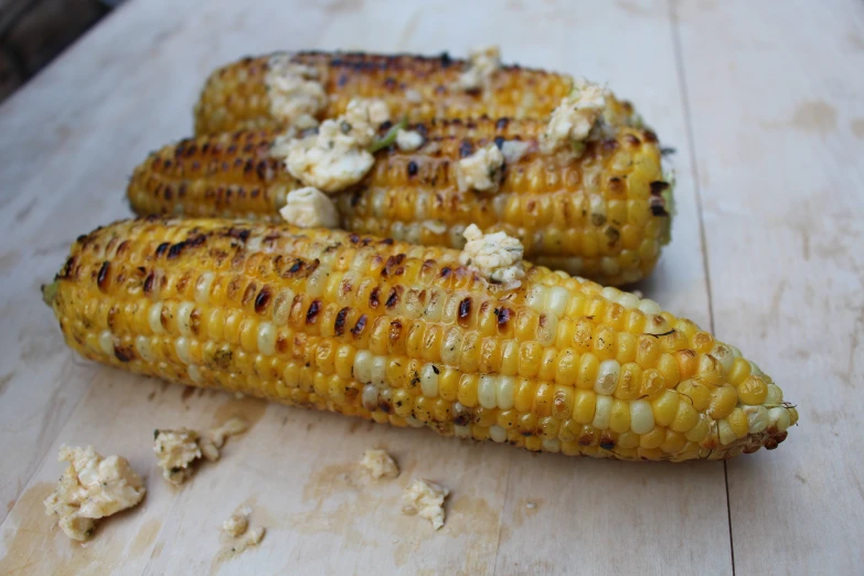 a couple of corn are sitting on the table