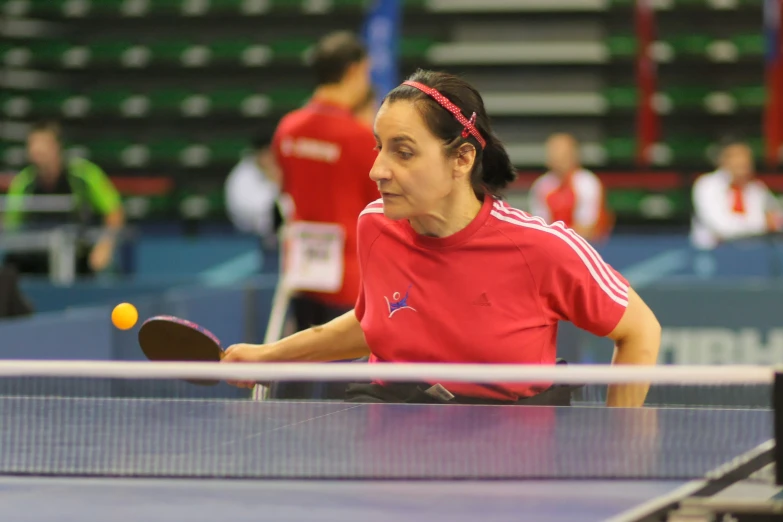 a woman hitting a ball with a racket on a court