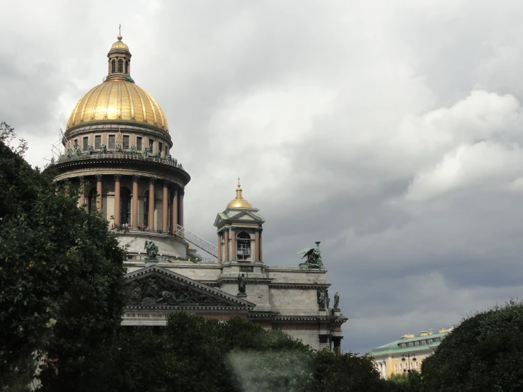 a view of a building with golden domes in the background