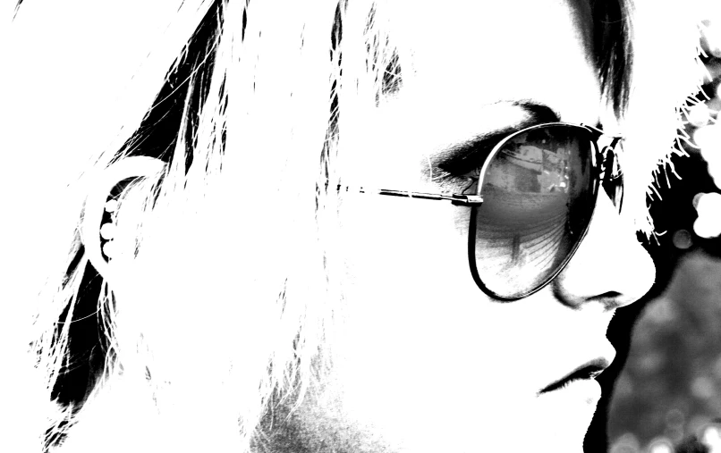 black and white pograph of woman with sunglasses