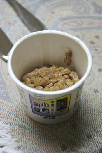 there is a container of yogurt with peanut er on the inside