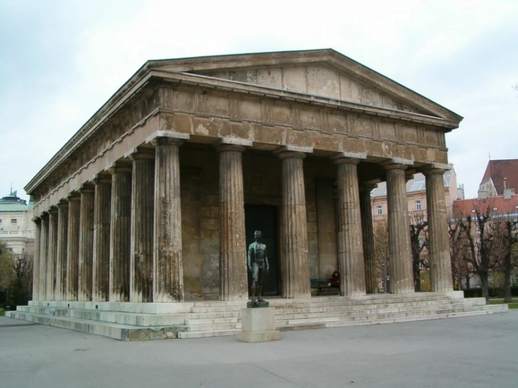 the ancient building is made from marble and has many pillars