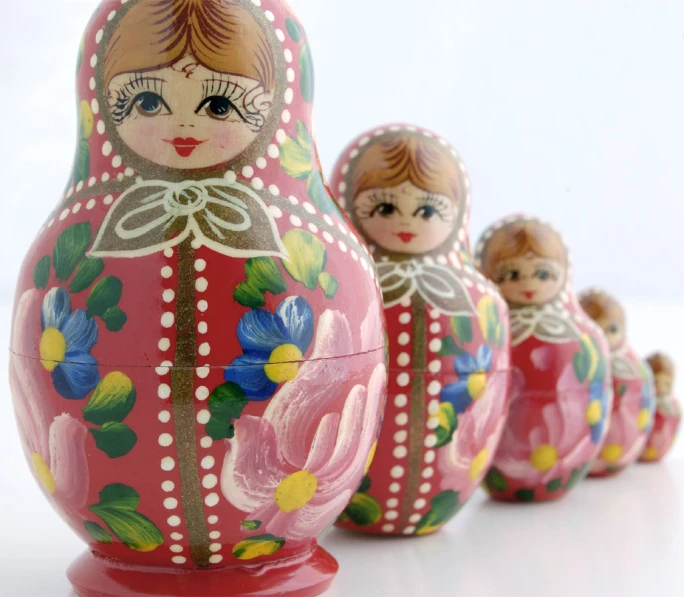 an russian nesting doll made with bright pink paint