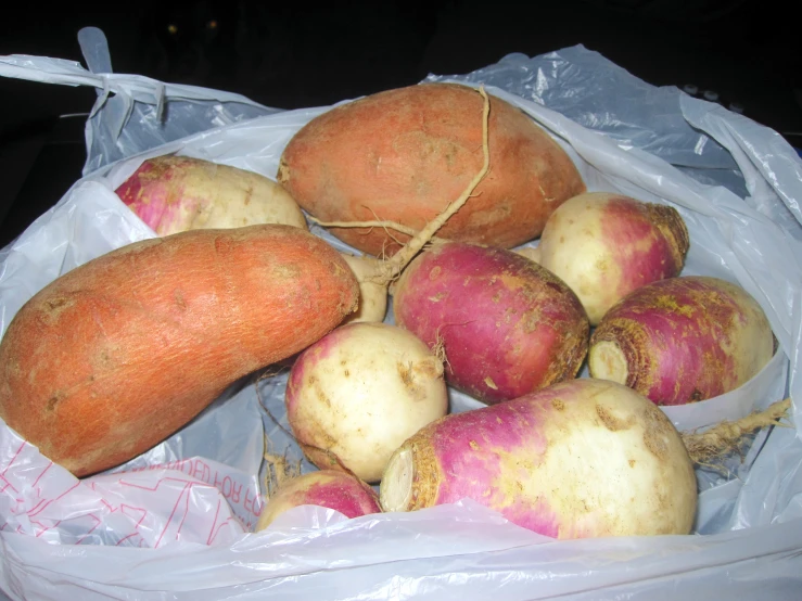 a bunch of potatoes in some plastic bags