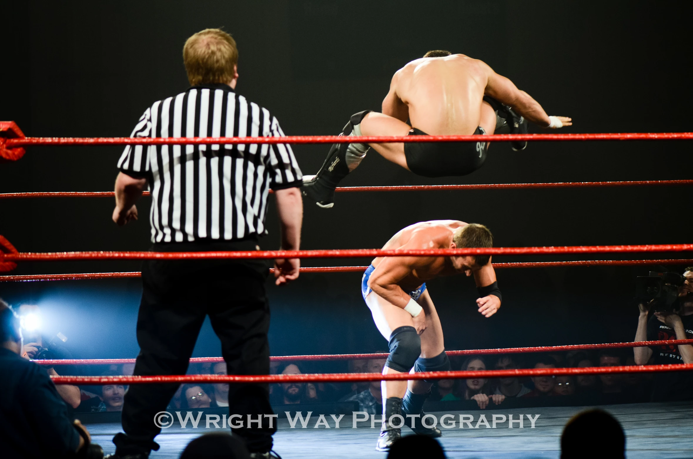 two men on wrestling ring facing each other