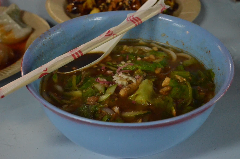 a bowl of food is filled with vegetables