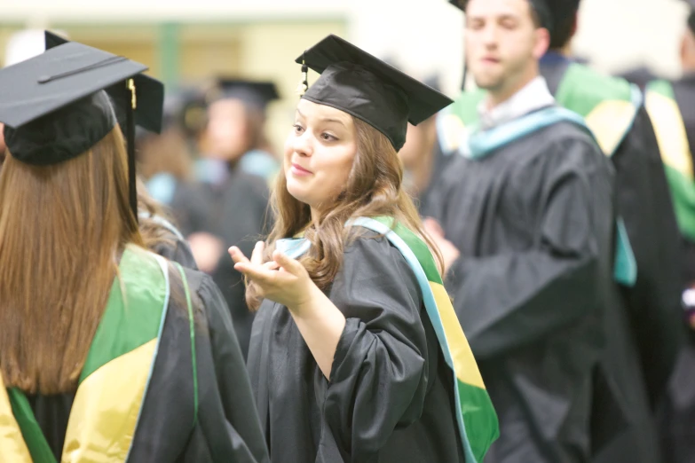 a woman standing at the end of graduation