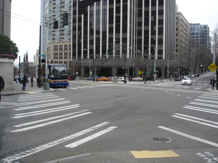 an intersection with two busses in the background