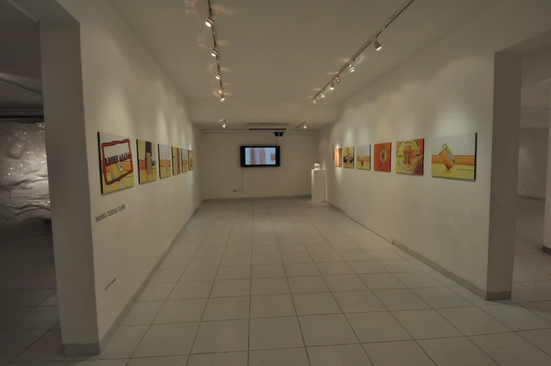 a view of a large room with white walls and floors