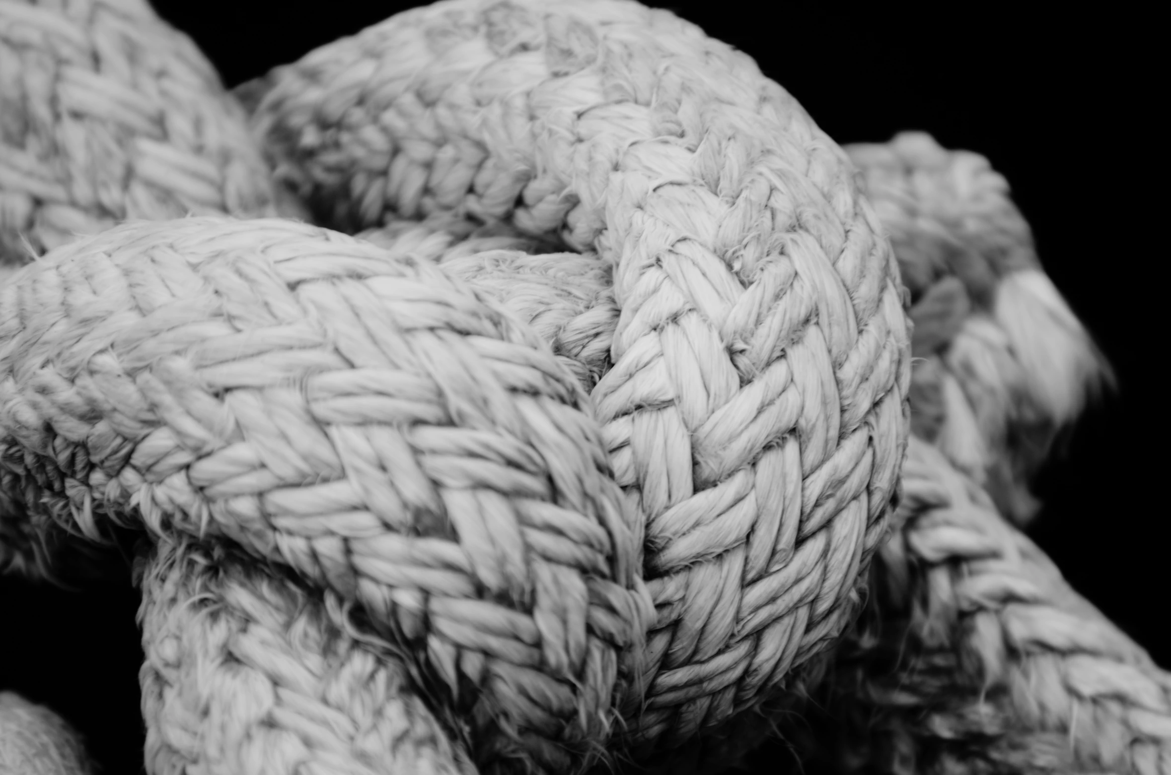 a rope like object that resembles the weaved edges of a large knot