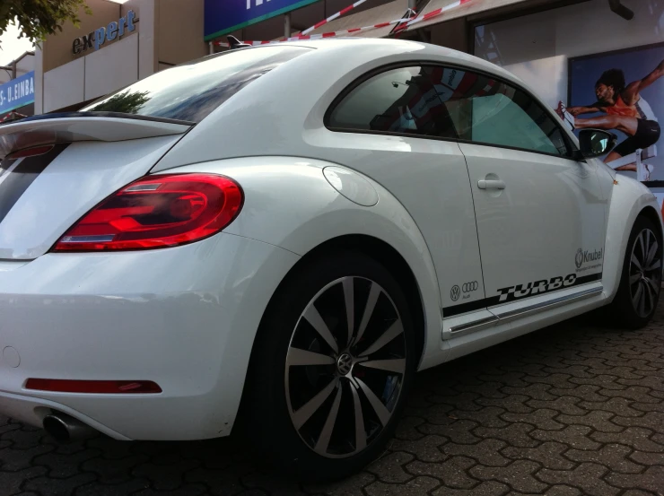 a bugatti sports car parked outside a business