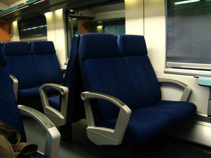 the seats on this train are blue in color