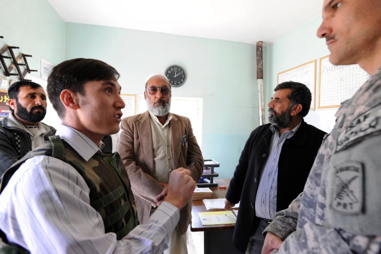 a group of men talking to each other