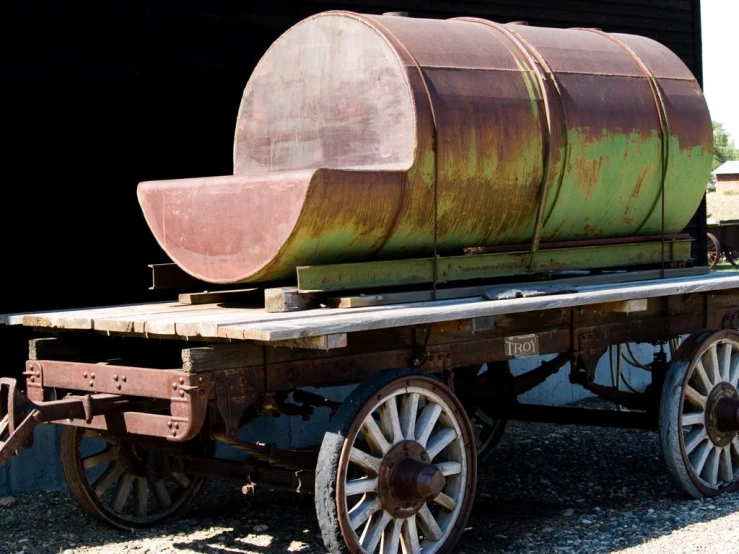 old rusty train cart with big round steel barrel