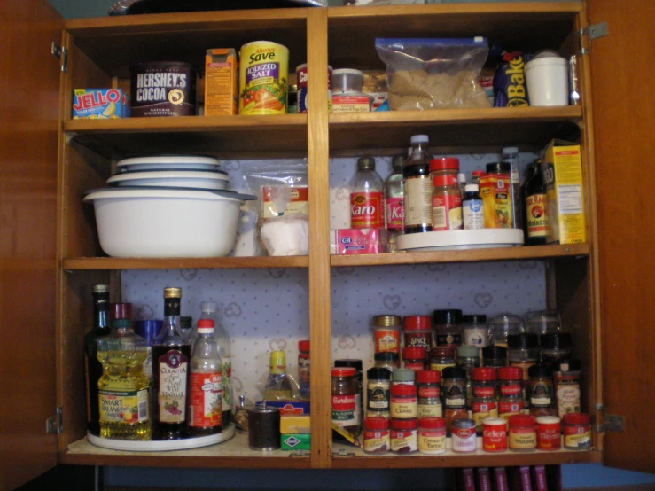 an old cupboard filled with spices and condiments