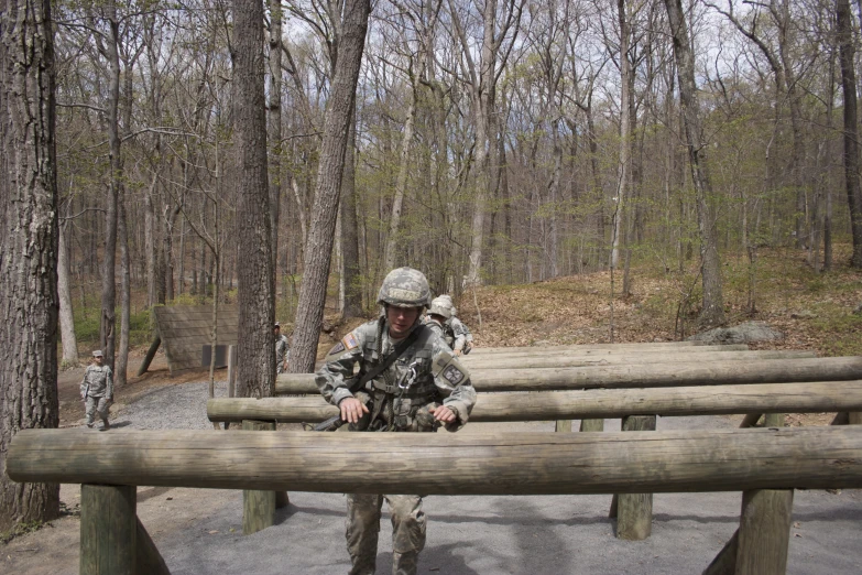 a person in camouflage sitting on a bench