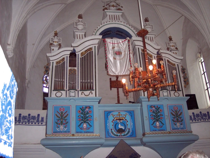 a blue and white church with organ