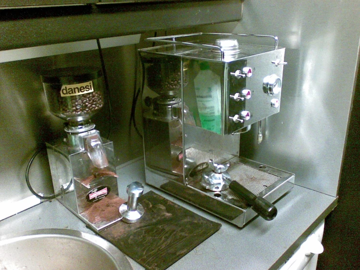 a coffee maker and a spice dispenser on a counter