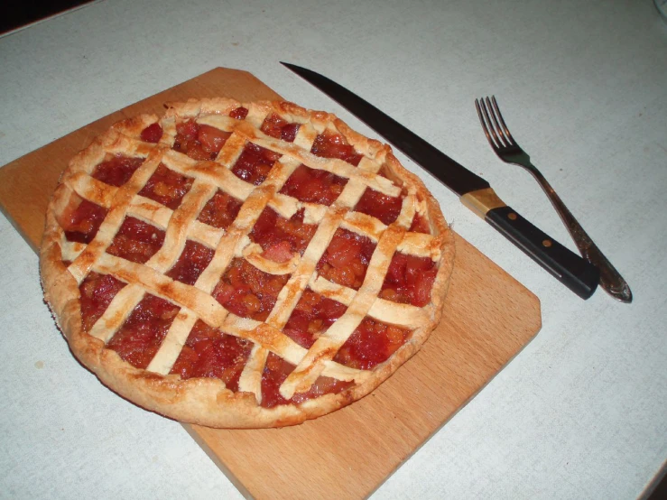 the pizza has been cut in half and served with a fork