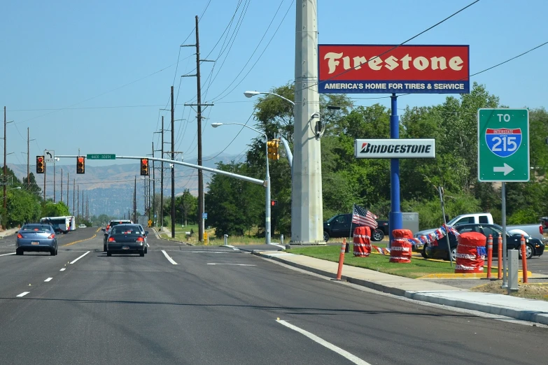 a street scene with a sign for firestone
