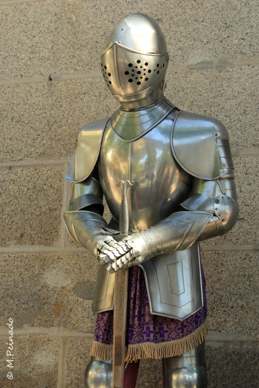 an armor on display in a large city building