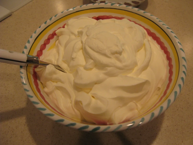 a bowl filled with a lot of white sauce