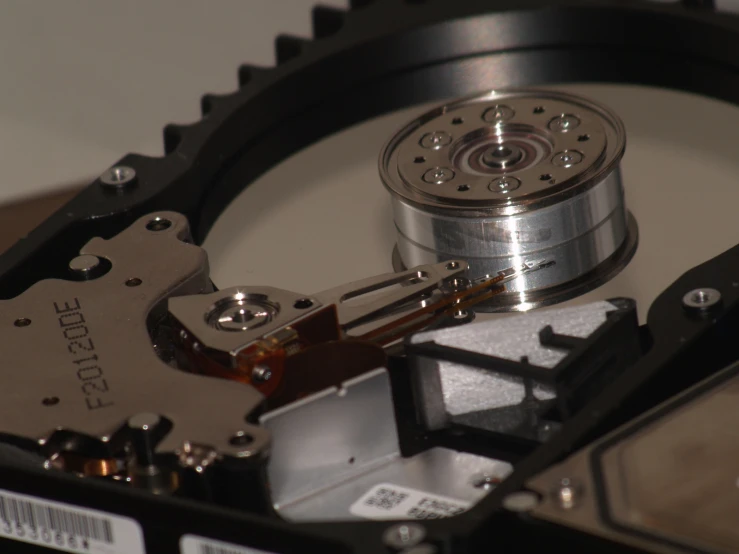 the inside of a hard drive with a silver lid