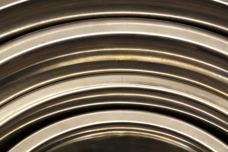 a stack of silver colored metal circles