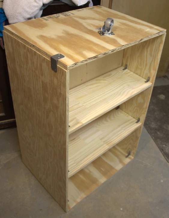 a wooden cabinet made of wood with a latch