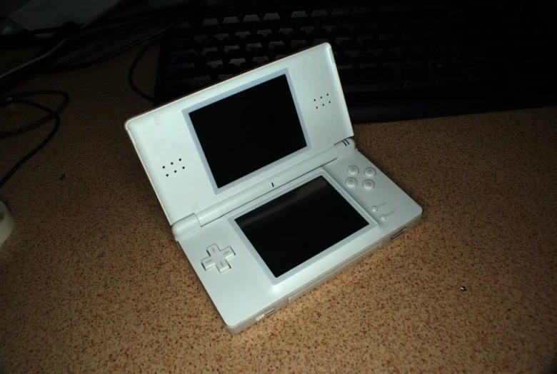 a white tablet pc with a keyboard and mouse