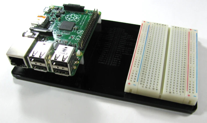 a board and device that is on a table