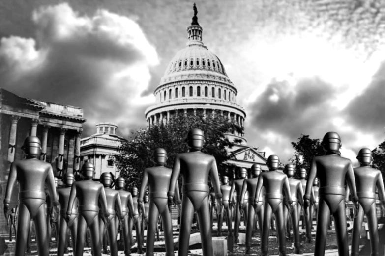 people walking near the statue in front of the capitol building