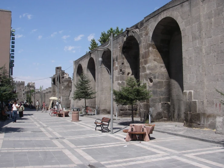 several benches sitting next to each other on the sidewalk