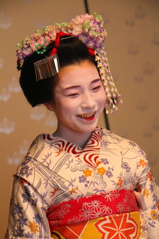 an asian woman wearing a traditional kimono