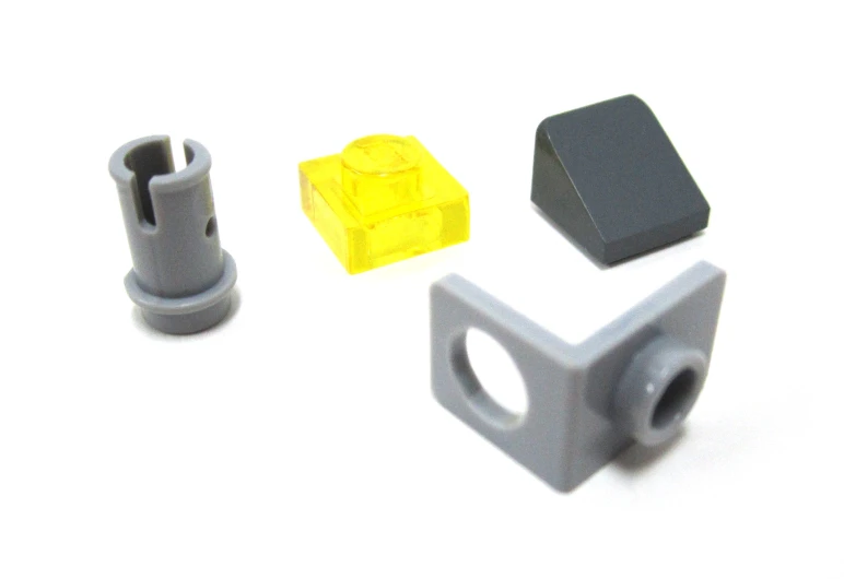 plastic components for a robot - type toy, on a white background