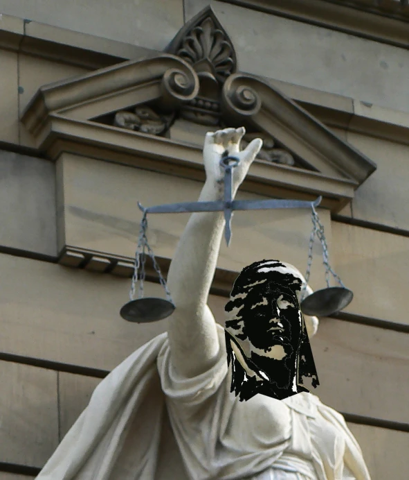 a statue is holding two scales in her hands
