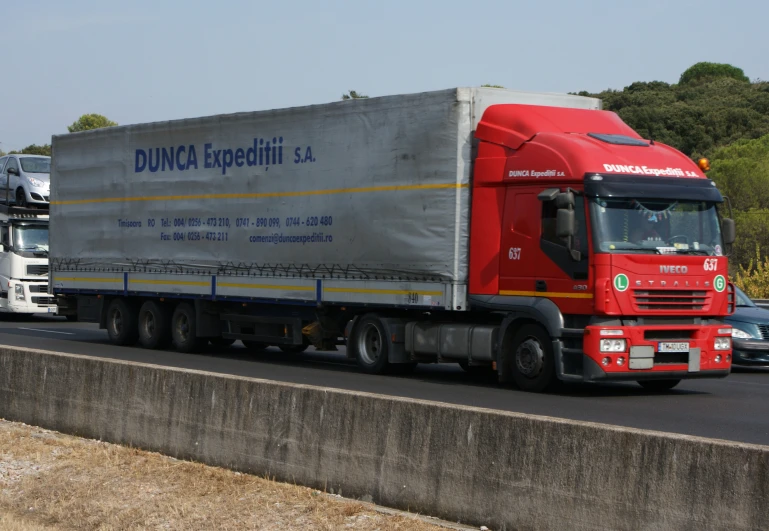 a truck that is driving down the street