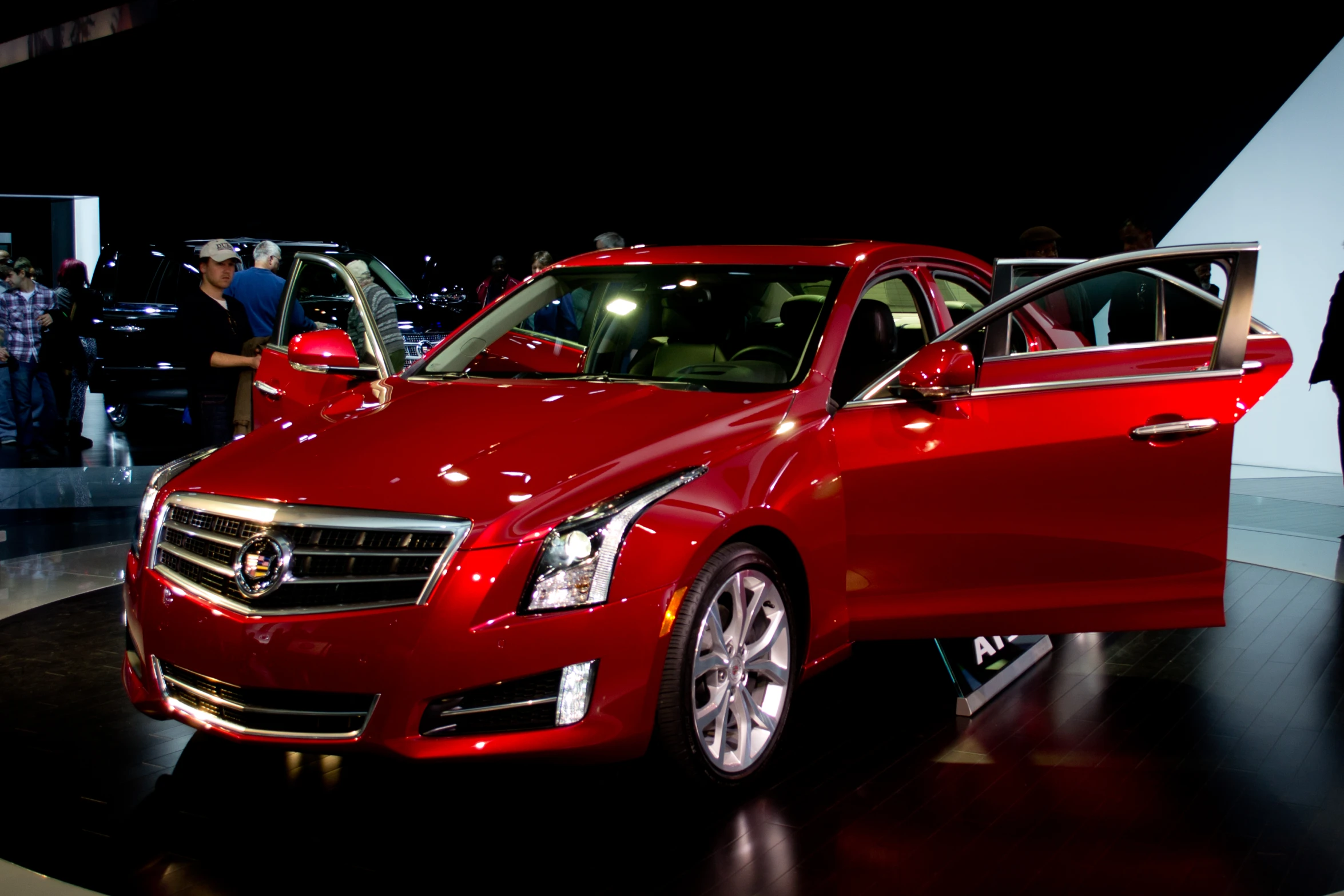 a cadillac car on display at the show