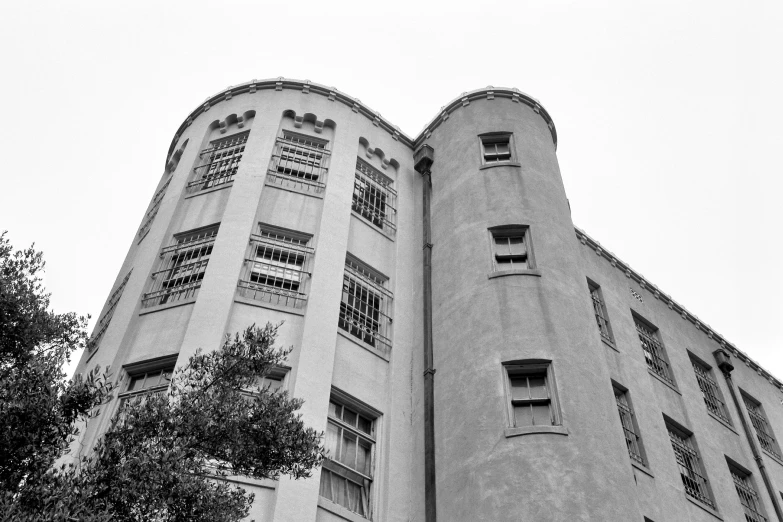 tall buildings with windows against a gray sky