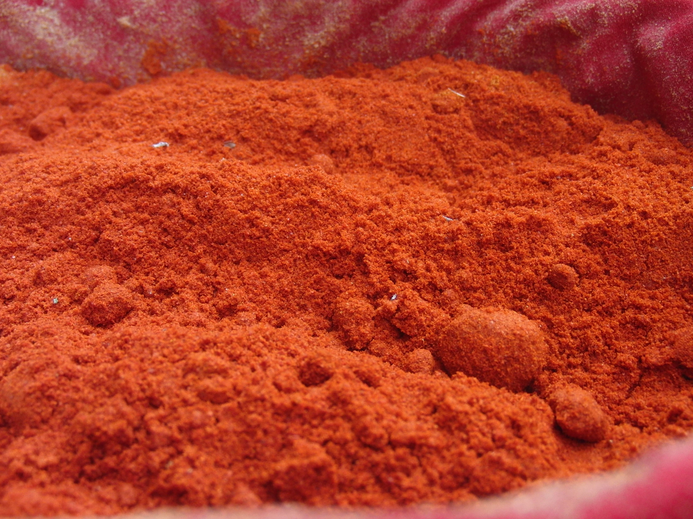 a bowl filled with lots of orange colored powder