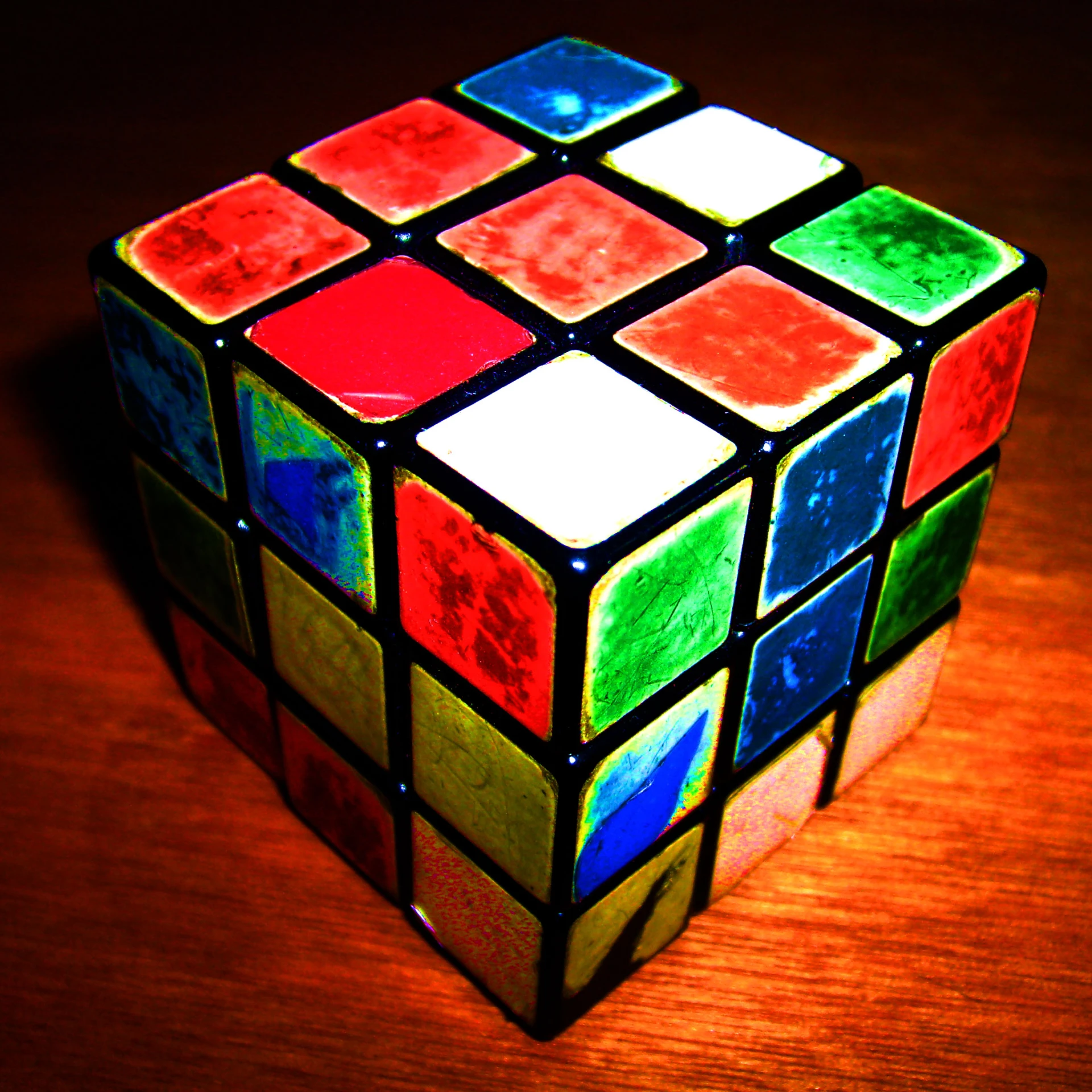 a multicolored cube that is sitting on a table