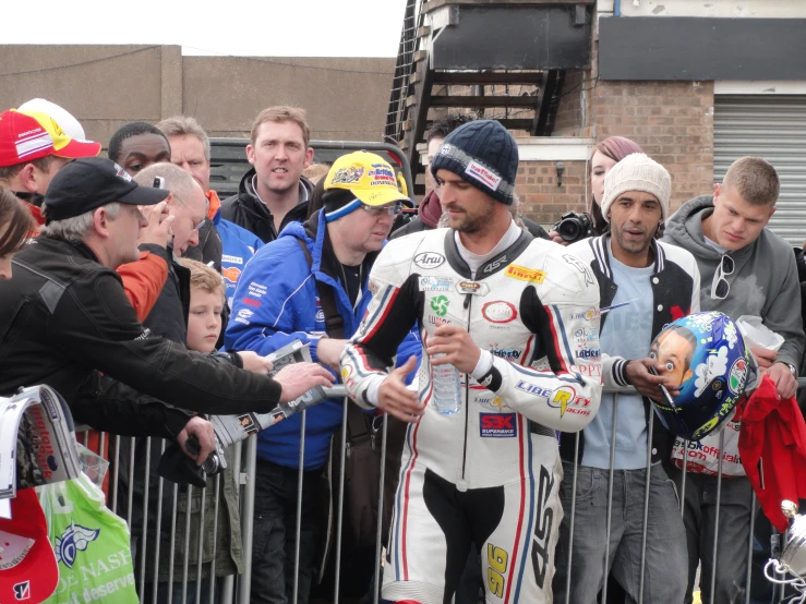 a number of people gathered together and shaking hands