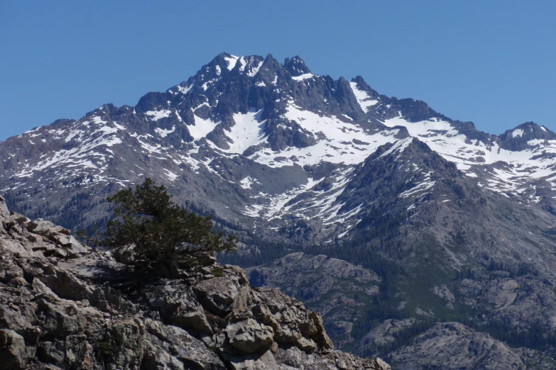 mountains covered in snow are seen from below